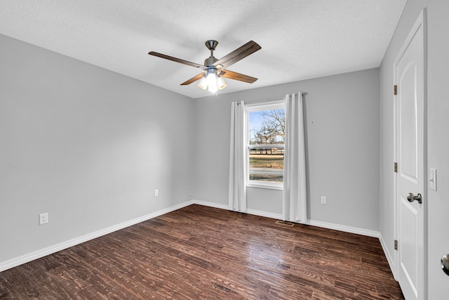 1989 Crawford St, West Plains, MO 65775 - empty room featuring ceiling fan, dark wood-type flooring, and a textured ceiling