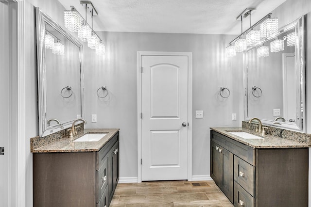 1989 Crawford St, West Plains, MO 65775 - bathroom featuring vanity and a textured ceiling