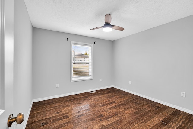 1989 Crawford St, West Plains, MO 65775 - unfurnished room with dark hardwood / wood-style flooring, a textured ceiling, and ceiling fan