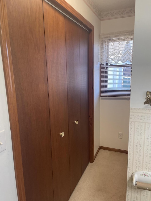 interior space featuring light colored carpet