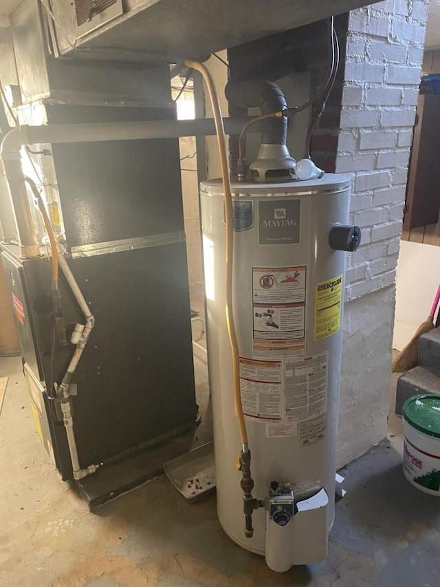 utility room with gas water heater and heating unit