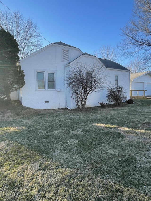 view of property exterior with a yard