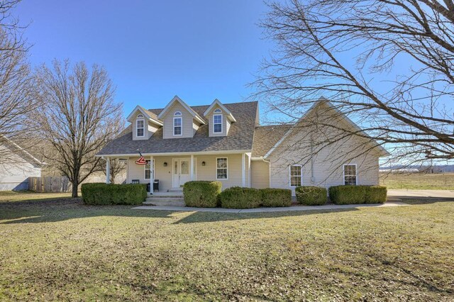 21 Meadow Brook Ln, Anderson, MO 64831 - cape cod-style house with covered porch and a front yard