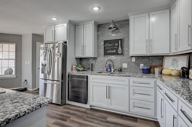 21 Meadow Brook Ln, Anderson, MO 64831 - kitchen with white cabinetry, backsplash, dark hardwood / wood-style floors, light stone countertops, and stainless steel fridge with ice dispenser