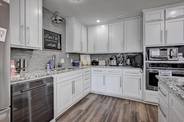 21 Meadow Brook Ln, Anderson, MO 64831 - kitchen featuring sink, dark wood-type flooring, white cabinetry, built in microwave, and oven