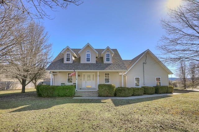 21 Meadow Brook Ln, Anderson, MO 64831 - new england style home featuring a front lawn and covered porch