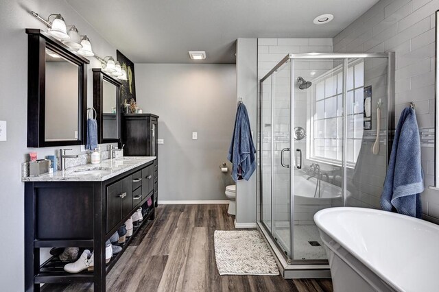 21 Meadow Brook Ln, Anderson, MO 64831 - bathroom with toilet, vanity, a shower with door, and hardwood / wood-style floors