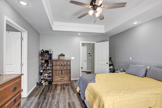 21 Meadow Brook Ln, Anderson, MO 64831 - bedroom featuring a raised ceiling, dark hardwood / wood-style floors, and ceiling fan