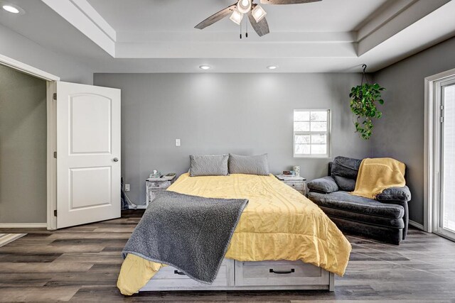 21 Meadow Brook Ln, Anderson, MO 64831 - bedroom with ceiling fan, dark hardwood / wood-style floors, and a raised ceiling