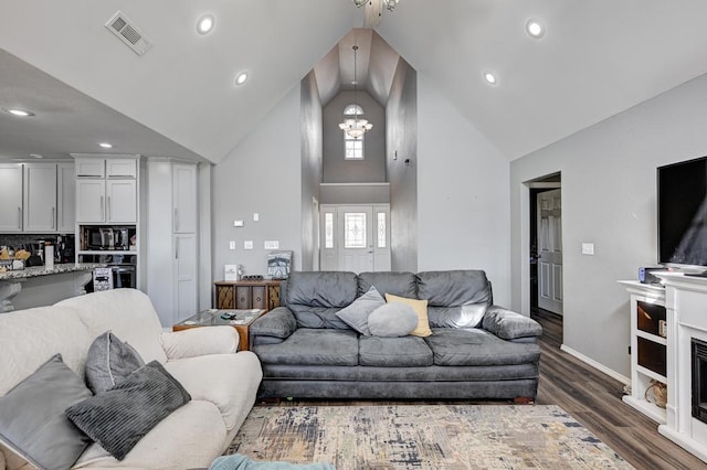 21 Meadow Brook Ln, Anderson, MO 64831 - living room with high vaulted ceiling, dark wood-type flooring, and a chandelier
