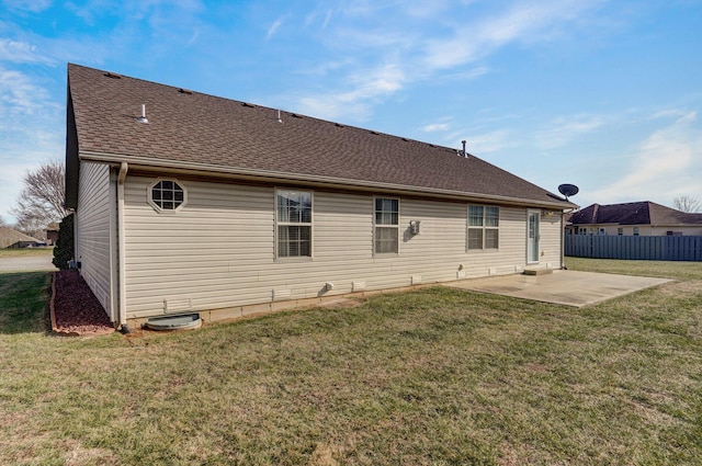 rear view of house featuring a patio and a lawn