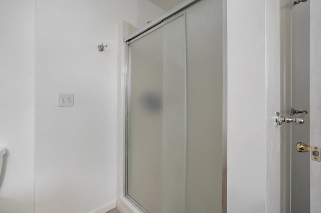 bathroom featuring an enclosed shower