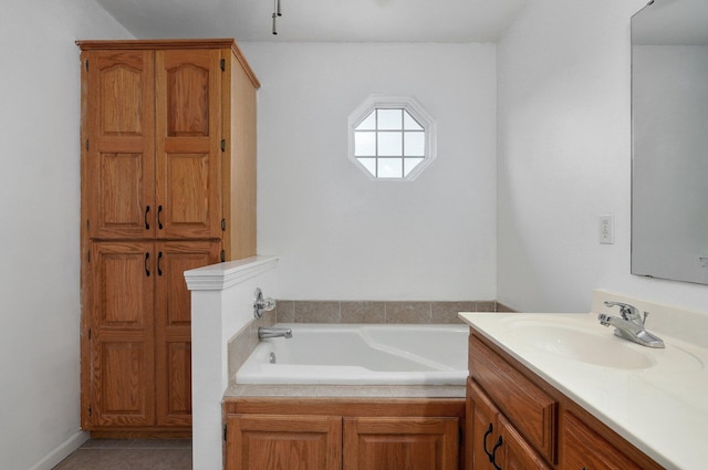 bathroom featuring vanity and a bath