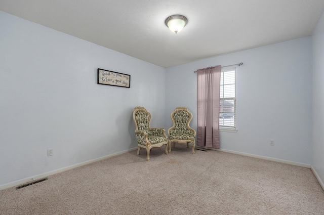 sitting room featuring carpet floors