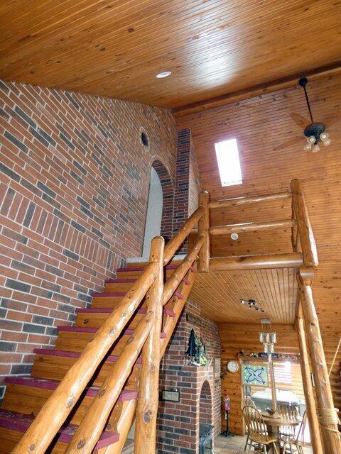 interior space featuring wooden ceiling and a high ceiling