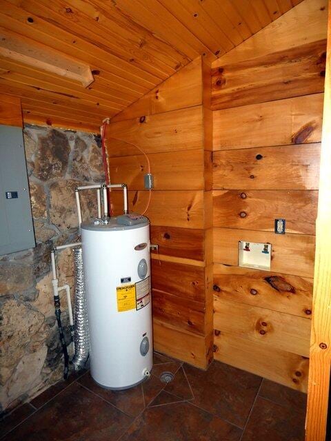 utility room with water heater and electric panel