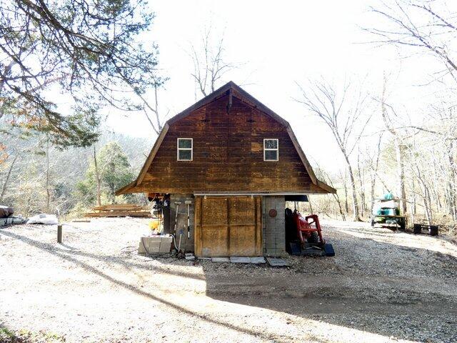 view of side of property featuring an outdoor structure