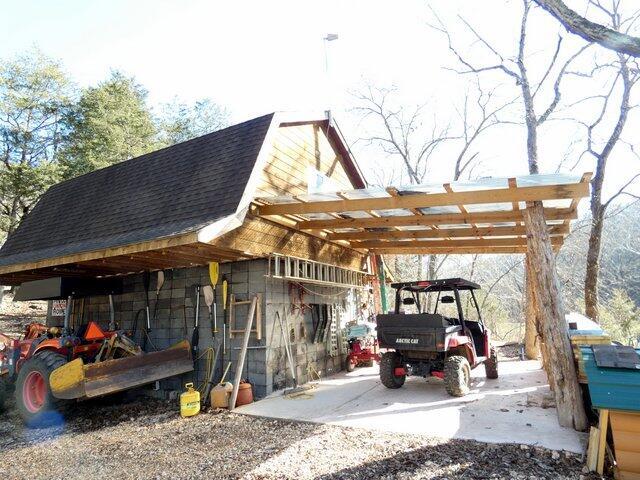 view of vehicle parking with a carport