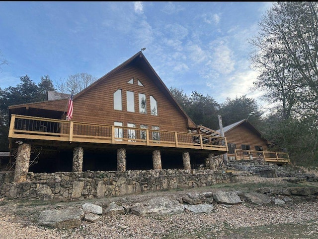 view of side of home featuring a wooden deck