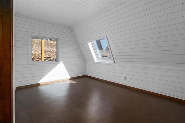 unfurnished room featuring a skylight