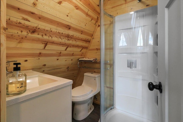 bathroom featuring wooden walls, a shower with shower door, vanity, toilet, and wooden ceiling