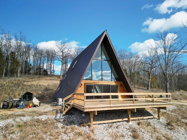 rear view of house with a deck