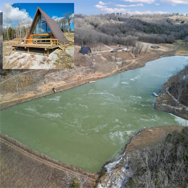 birds eye view of property featuring a water view