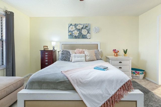 bedroom featuring light colored carpet