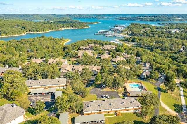 birds eye view of property with a water view