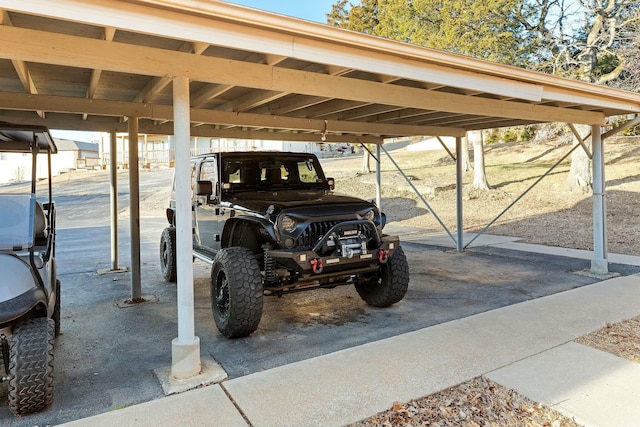 view of parking / parking lot with a carport