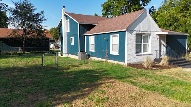 view of home's exterior with a yard