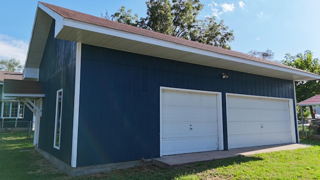 garage featuring a yard