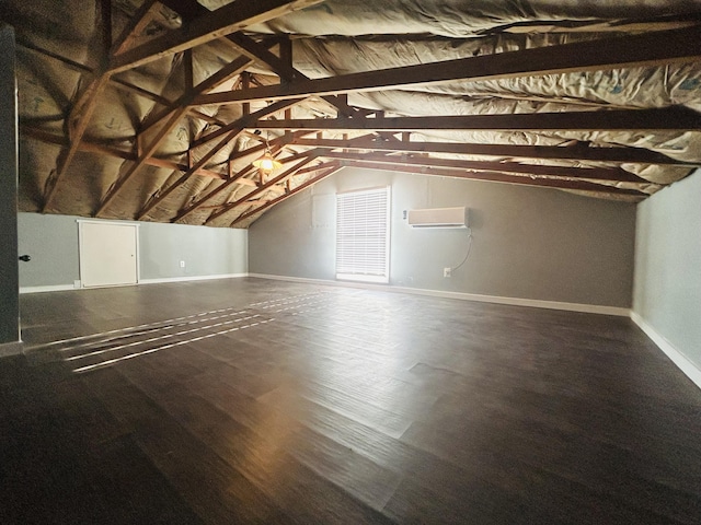 attic featuring a wall mounted AC