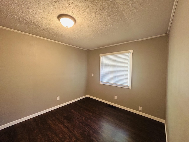 unfurnished room with ornamental molding, wood-type flooring, and a textured ceiling