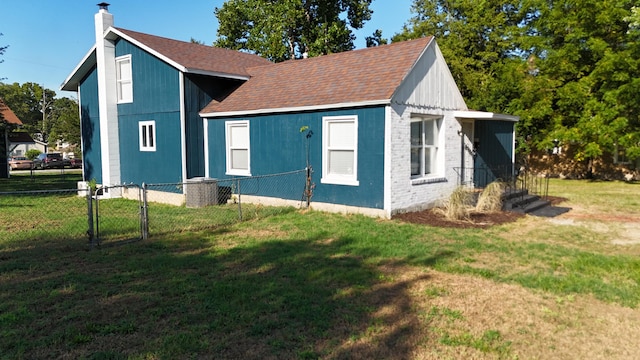 view of property exterior with a yard