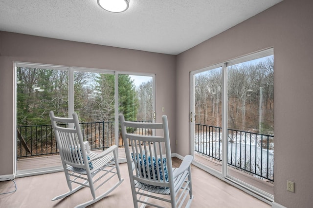 sunroom / solarium featuring plenty of natural light