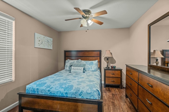 bedroom featuring dark wood-type flooring and ceiling fan