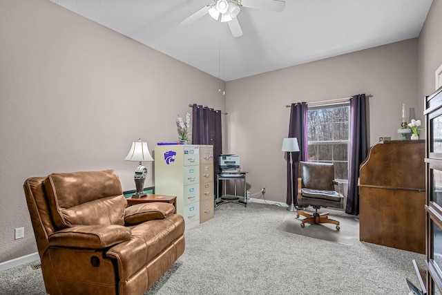 sitting room with ceiling fan and carpet