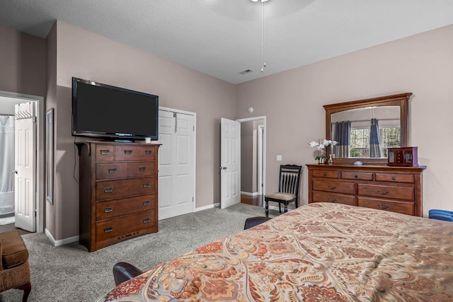 carpeted bedroom featuring a closet