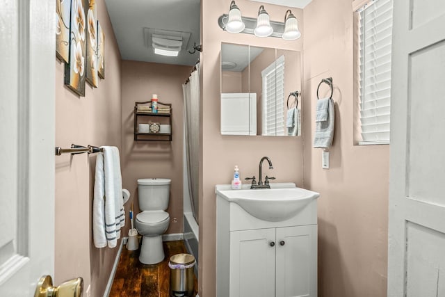 bathroom with vanity, wood-type flooring, and toilet