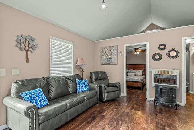 living room with lofted ceiling, dark hardwood / wood-style floors, and heating unit