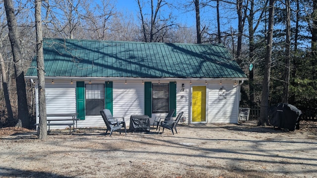 view of front of house with a fire pit