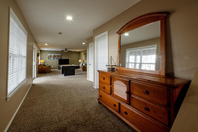 hallway with carpet floors