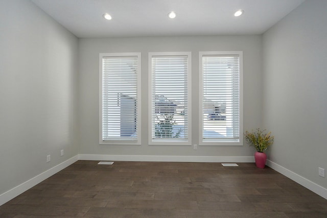 spare room featuring dark hardwood / wood-style floors