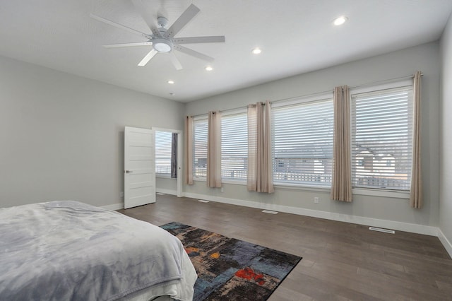 bedroom featuring dark hardwood / wood-style floors and ceiling fan