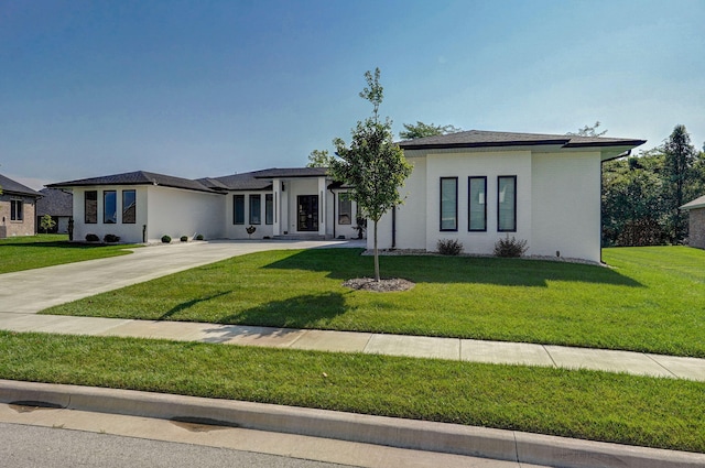 prairie-style home with a front yard