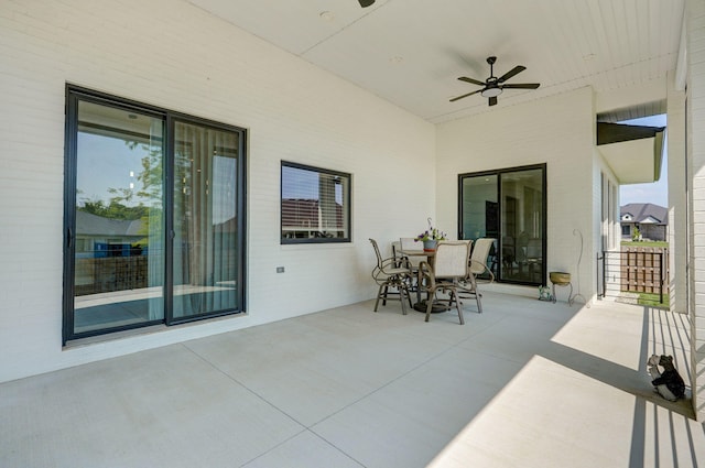 view of patio featuring ceiling fan