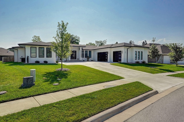 ranch-style house with a garage and a front yard