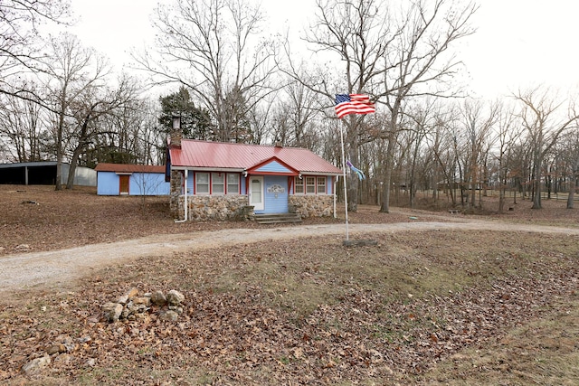 view of front of home featuring an outbuilding