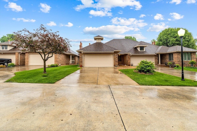 view of front of home with a garage and a front yard